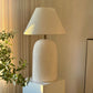 oversized ceramic lamp on a pedestal